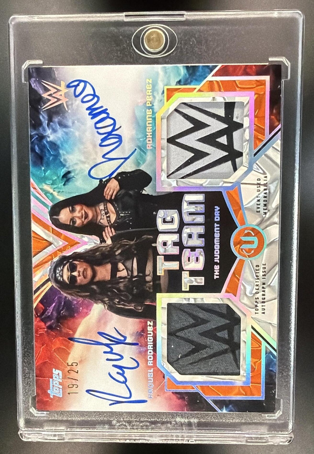 2026 Topps Universe WWE Roxanne Perez Raquel Rodriguez #TTR-JD Tag Team Relic Auto Orange Warp /25